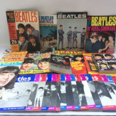 A collection of Beatles ephemera comprising various Beatles book monthly magazines from number 3 through to 21, concert magazines, books, a scrapbook etc.