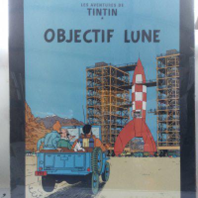 A framed Tintin poster for Destination Moon, approx 60cm x 80cm including frame.