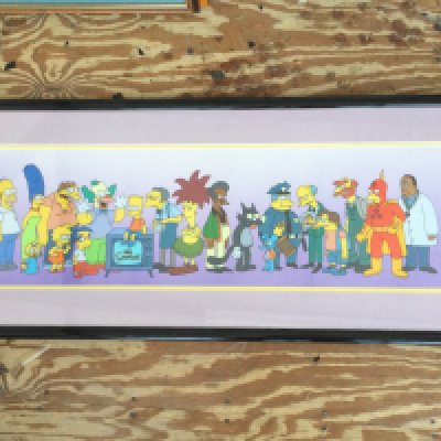 Two framed and glazed animation serigraph cels of characters from The Simpsons, one signed by Wes Archer. Largest approx 105cm x 44cm including frame.