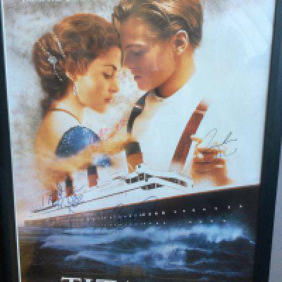 A multi signed US one sheet film poster for James Cameron's Titanic, signed by Leonardo DiCaprio, Kate Winslett, James Cameron, Bill Paxton and Bernard Hill. Framed and glazed, not folded.