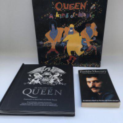 A 40 Years of Queen book complete with inserts, a Freddie Mercury autobiography and 'A Kind Of Magic' LP (3).