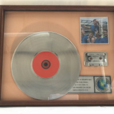 A framed and glazed limited edition platinum disc, CD and cassette display in recognition for worldwide sales of the Sing When You're Winning album by Robbie Williams. Number 5/60. Approx 53cm x 43cm.