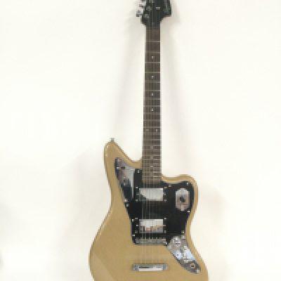 A 2014 Fender Squier Jaguar electric guitar in a gold sparkle finish. Comes with retail box.