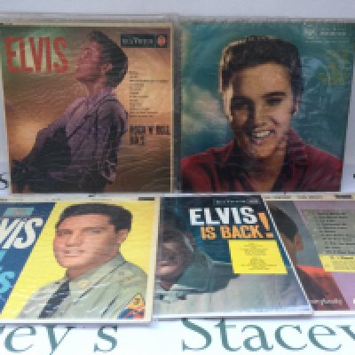 A box of Elvis Presley LPs, 7" singles, EPs, DVDs and three Elvis monthly magazines.