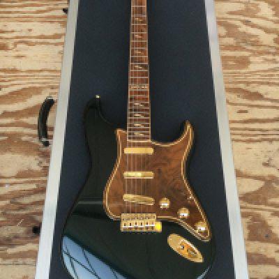 A very rare Fender Custom Jaguar Stratocaster XK-50 in brand new excellent condition. Number 20 of 25. Limited edition by the Fender custom shop in partnership with Jaguar. Only 5 of these guitars made it into the public domain, the other 20 went to Jaguar dealerships. Includes all case candy, protective case and original bag made from the same leather as the car interior. Comes with a limited edition Fender Custom shop hardback book with slipcase.