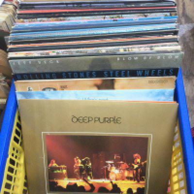 A collection of LPs by various artists including Deep Purple, Jeff Beck, The Who and others.