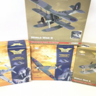 4 Boxed Corgi Aviation Archive Diecast Models including A Spitfire. A Swordfish. A Mustang (No Stand) and a Gloster Sea Gladiator.