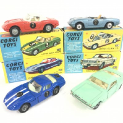 7 X Boxed Corgi Vehicles. A Lotus Elan Coupe #319. A Lotus Elan S2 #318 A/F. A Marcos 1800 G.T. #324. a Ford Mustang #320. A Porsche Carrera 6 #330. A M.G.B G.T. #327 And a Lancia Fulvia Sport Zagato #332.
