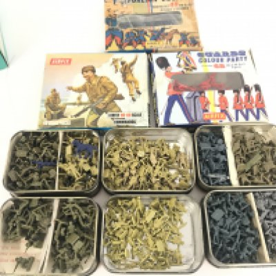 A Box Containing a Collection of Plastic Miniature Soldiers.