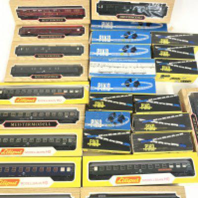 A Collection of Boxed H0 Gauge Coaches and Wagons including Liliput and Piko.