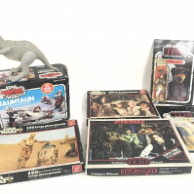 A Box Containing a Collection of Vintage Star Wars Puzzles. Figures. Board Games. Etc.