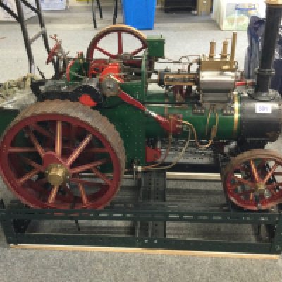 A lovely example of a Charles Burrell 2̢&#2013266057&#2013265922&#2013265922&#2013266269 scale traction steam engine. Approx length 90cm , approx width 40cm. Housed on a travel stand.
