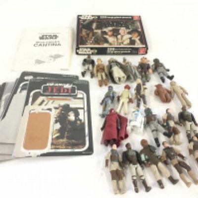 A collection of vintage Star Wars figures..card backs..jigsaw