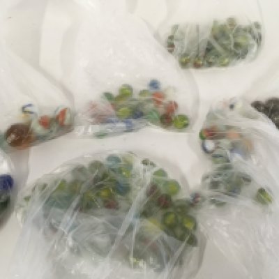 A collection of assorted types of marbles with varying ages and sizes. NO RESERVE