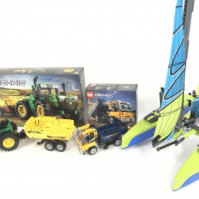 A Lego John Deere 9620R 4WD Tractor #42136 (With Box). A Dump Truck #42147 (With Box) and a Catamaran #42105. NO RESERVE