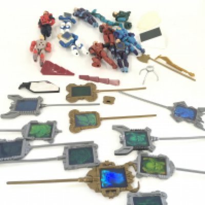 A collection of Visionaire figures and accessories.