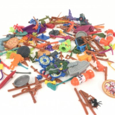 A collection of assorted Ninja Turtle accessories.