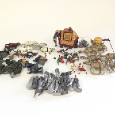 A box containing a quantity of mixed Britains. Crescent lead figures to include circus. Cowboys. State elephant and camel corps. Also Britains white metal figures.