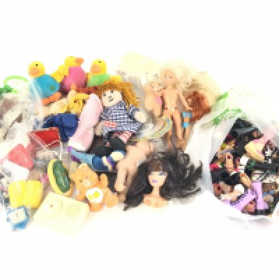 A box containing a large quantity of mostly dolls accessories such as Bratz and Barbie.