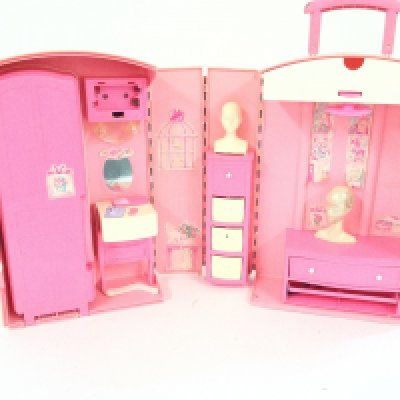 A box containing a vintage Barbie house take along suitcase. Also 3 boxes of various accessories.