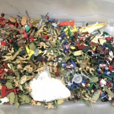 A bag Containing a Collection of Various Plastic Toy Soldiers. Cowboys and Indians.