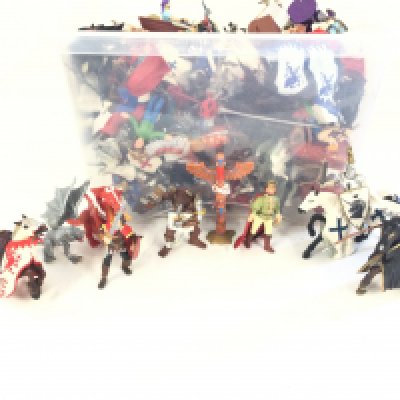 A box containing a quantity of toy figures. Mostly of knights. Horses and associated.