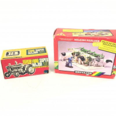 A Boxed Britains Ford Super Major 5000 Diesel Tractor. Also a Boxed Britains Milk Parlour.