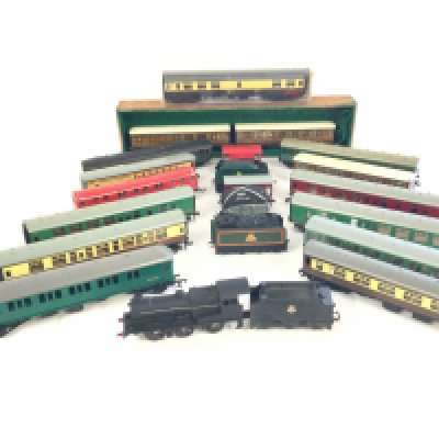 A box containing 15 00 gauge coaches. Plus 5 tenders. Plus a Formo 00 Gauge locomotive.