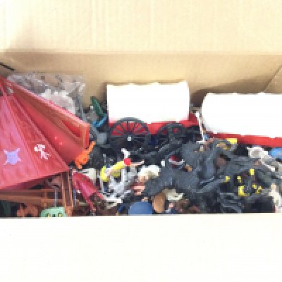 A box containing a quantity plastic figures to include soldier̢&#2013266057&#2013265922&#2013266146s. Horses. Wagons etc.