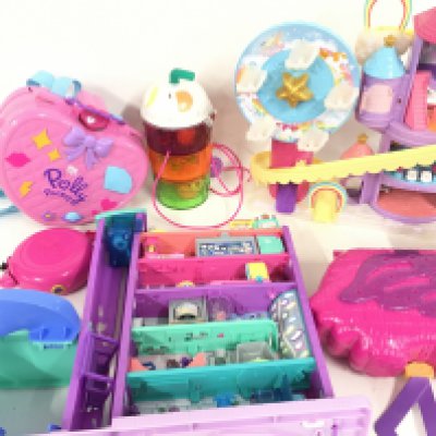 A Box Containing Polly pockets and accessories.