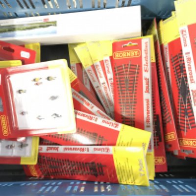 A box Containing carded 00 Gauge Hornby Track and figures. No Reserve.
