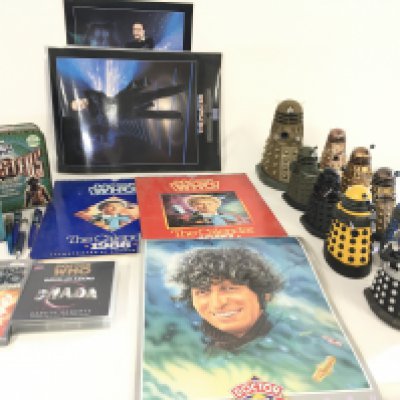 A collection of Dr. Who related pieces including 9 Daleks .boxed dvds..calendars..laminated posters etc