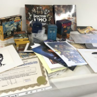 A large collection of Dr Who memorabilia including signed pictures..money boxes..jigsaw ..dvd board game plus many other items.