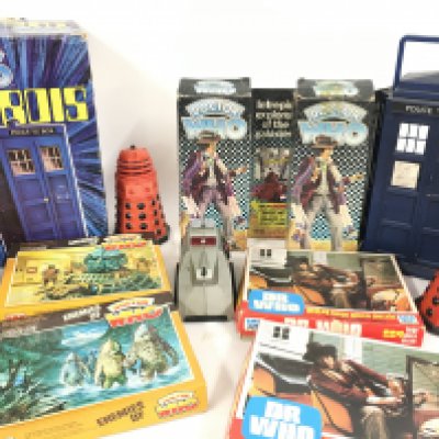 An assorted collection of Dr Who toys through the ages including puzzles..collectors case with all figures..k9 ..3 red speaking daleks ..a Tardis..action figure