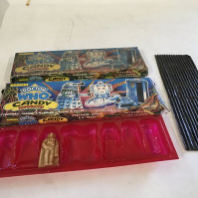 Two Dr Who candy boxes from 1980. 1 completely empty..the second has the candy tray with 1 piece remaining ( not edible) plus the protective sheet. Vary scarce pieces.