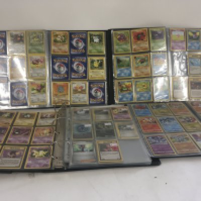 A collection of Pok&#2013265932&#2013265924&#2013266281mon Cards including several albums.