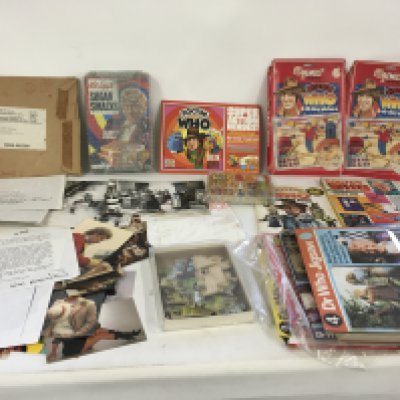 A mixed collection of of Dr Who memorabilia including toys..jigsaws..press photos and press releases some signed..cereal packaging etc