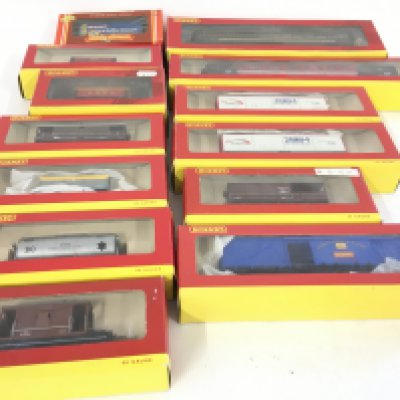 A collection of 13 Boxed Hornby 00 gauge model railway wagons and coaches