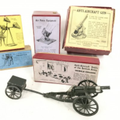 A Collection of Boxed Britains. Including a Sound Locator. a Predictor. A Mobile Chassis. A Anti-Aircraft Gun and a Searchlight. Also A Loose Field Gun.