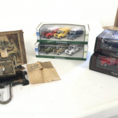The Little Beauty small sewing machine in box with instructions..made in Germany. 2 boxed Cararama sets with 3 land rovers in each..2 boxed Mini Cooper gift sets with 2 cars in each.