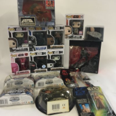 A collection of Star Wars funko pops and toys