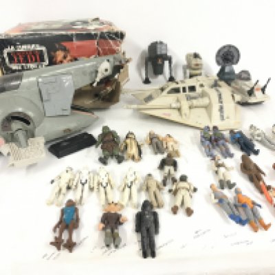 A collection of vintage Star Wars vehicles and figures. Includes Slave 1 vehicle and Snowspeeder.