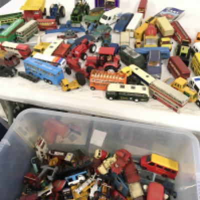 A large box contains a mixed lot of Playworn diecast model vehicles by various manufacturers.