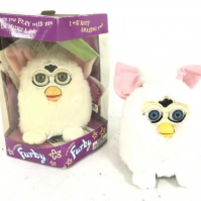 1 Boxed and 1 loose Furbys.