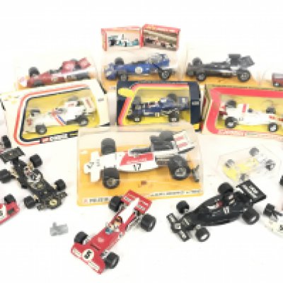 A Collection of Boxed and Loose F1 Cars Including Corgi and Polistil. Boxes are Worn.