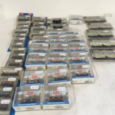 A collection in excess of 40 pieces of N gauge railway carriages by Peco and passengers by Graham Farish