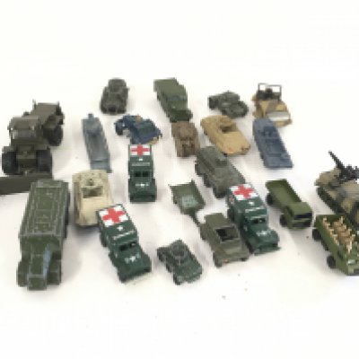 A collection in excess of 20 Playworn diecast model military vehicles by various manufacturers.