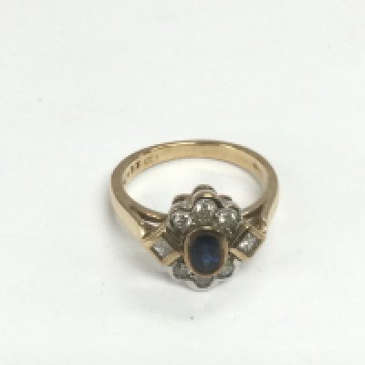 A gold, diamond and sapphire cluster ring, approx .33ct, approx 4g and approx size N. Shipping category A.