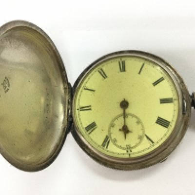 A silver cased hunter pocket watch. Not seen running.