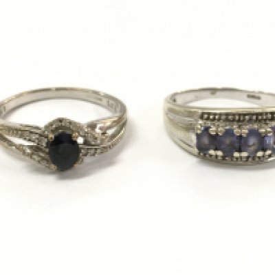 Two 9ct white gold and stone set rings . Black stone ring 2.2g total weight size O/N, other ring 2.8g total weight ,size O. Postage category A
